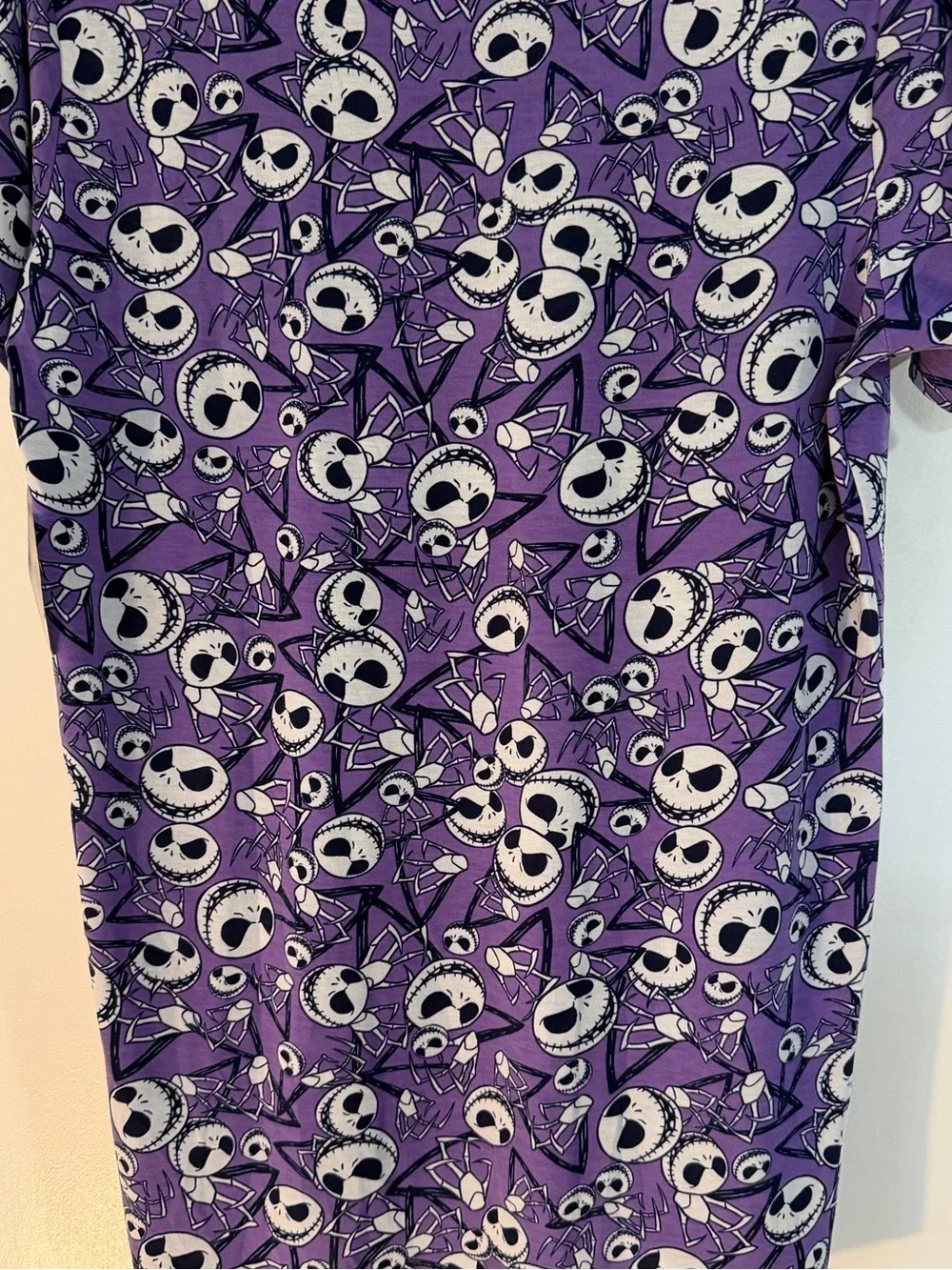 LuLaRoe Purple Short Sleeve Shirt with Black & White Skull Faces